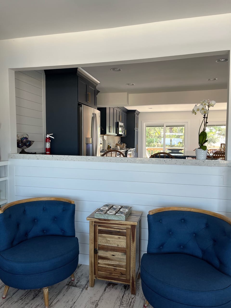 Quaint seating for two beneath the bar. 