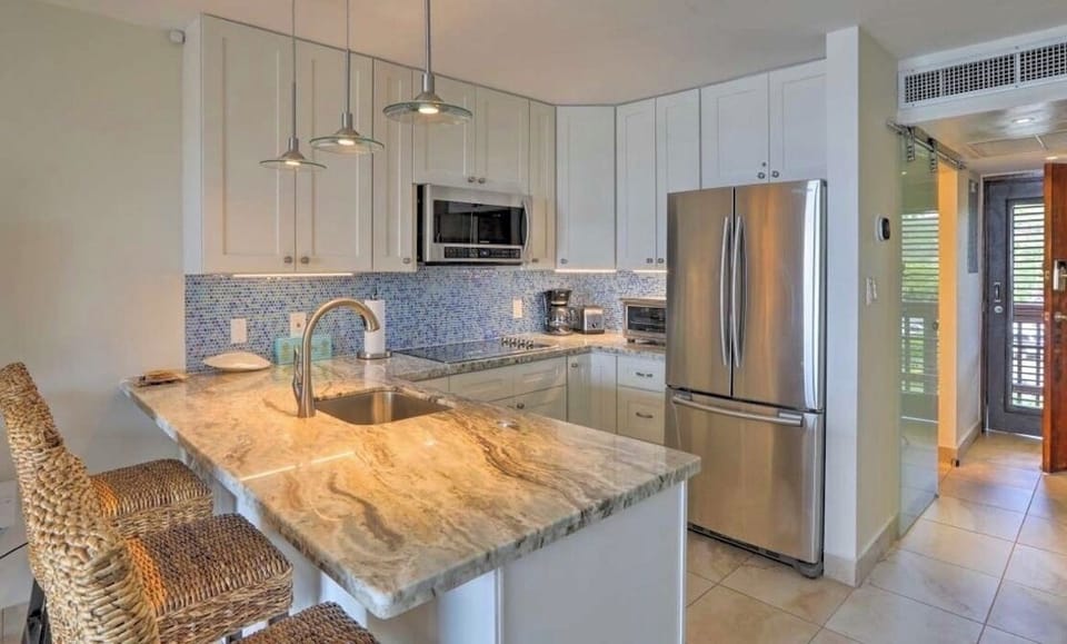 Newly renovated kitchen with new appliances and furniture