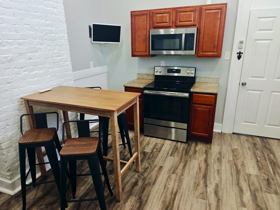 Kitchen table for 4. Additional folding table and chairs on site. 