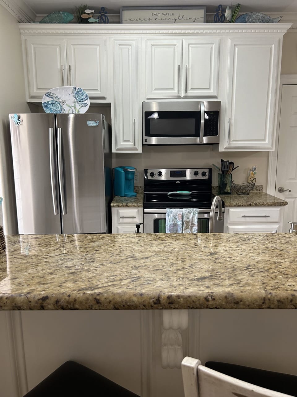 Kitchen with stainless steel appliances.