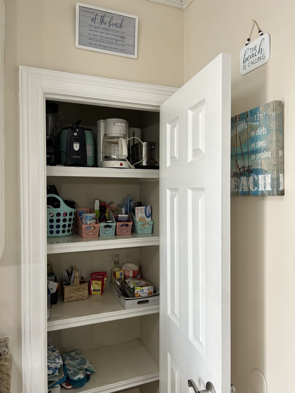 Small appliances inside the pantry. 