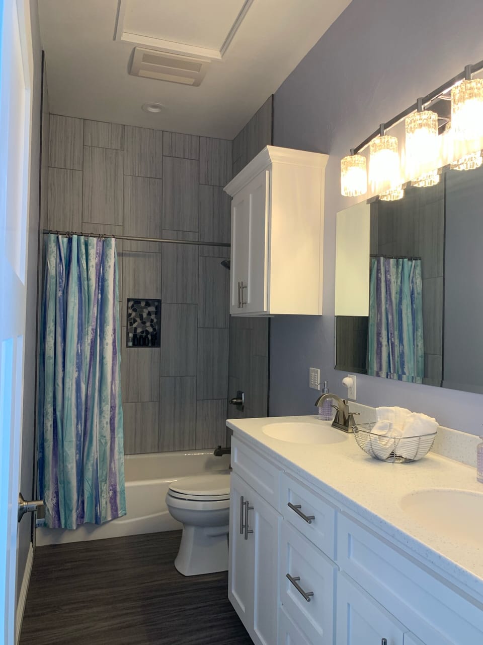 Larger bathroom with shower & tub with 
double sinks & corian countertops 