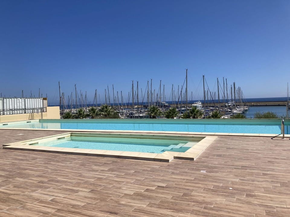 Water, Sky, Water Resources, Azure, Rectangle, Building, Swimming Pool, Plant, Composite Material, Roof