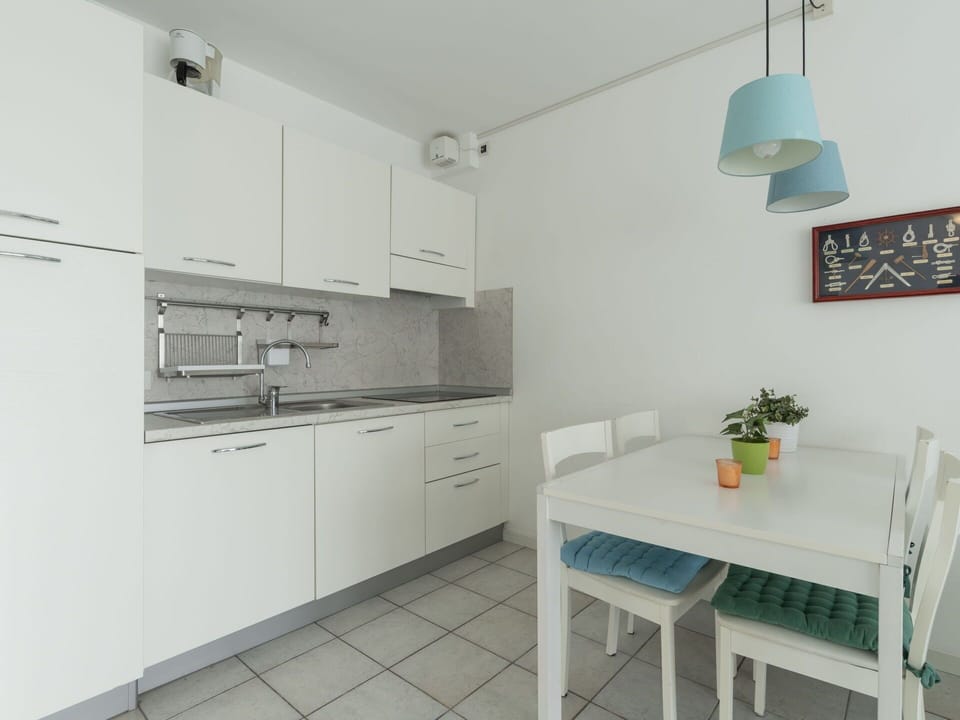 Cabinetry, Furniture, Countertop, Table, Lighting, Interior Design, Building, Kitchen Appliance, Kitchen Stove, Kitchen
