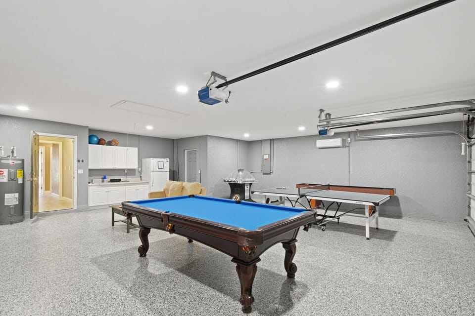 Game room with A/C, pool table, air hockey table, foosball table and shuffleboard