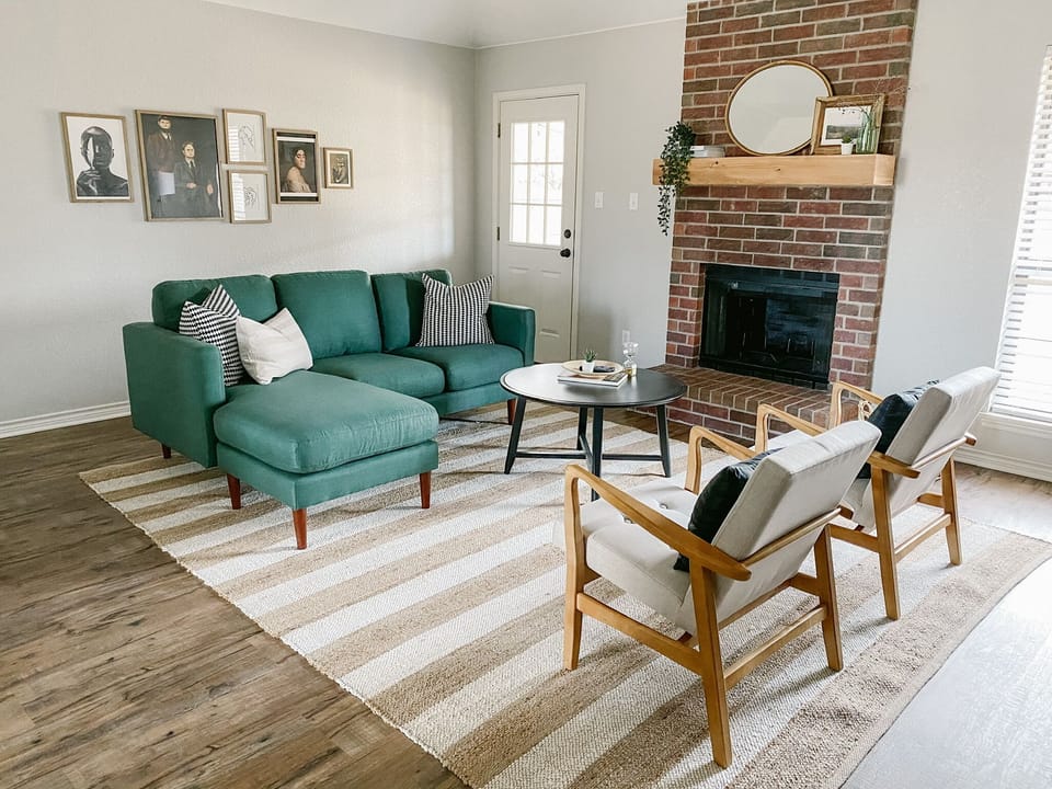 Relax in our stylish and comfortable living room-- featuring a 50" Roku TV!