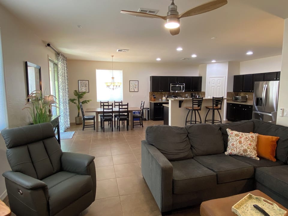 Open concept family room, kitchen and dining area.