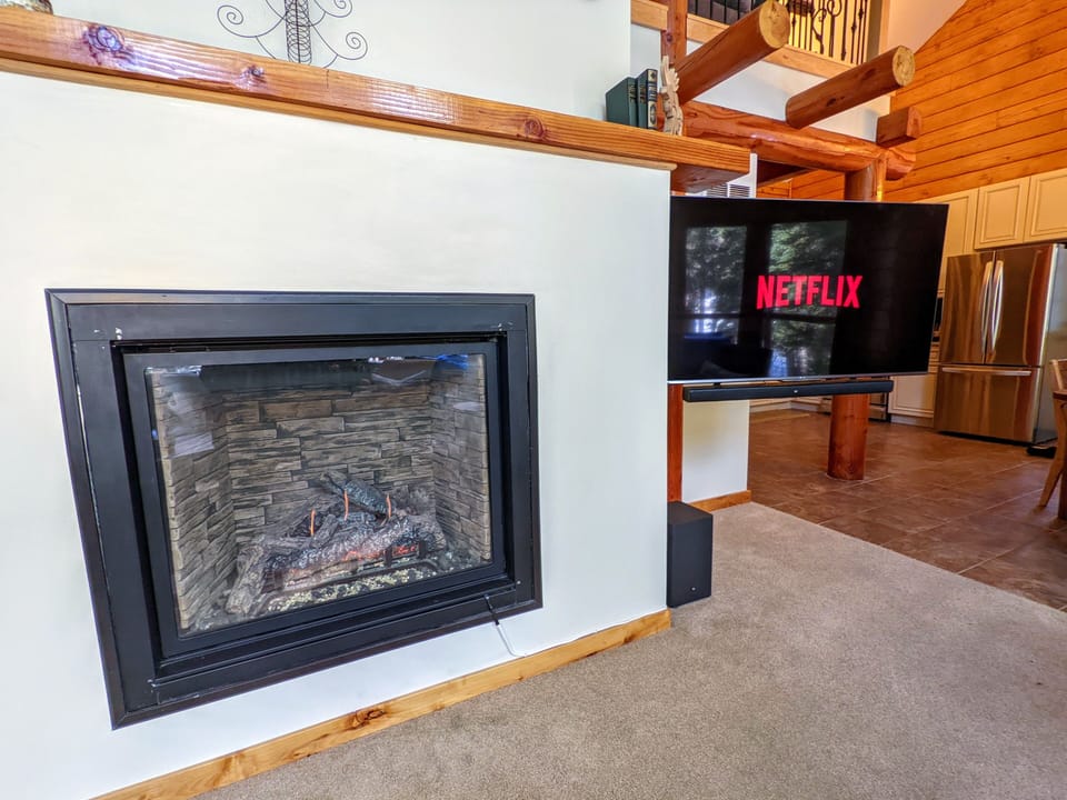 Gas fireplace & 55" smart TV (no cable/satellite; bring your own subscription)