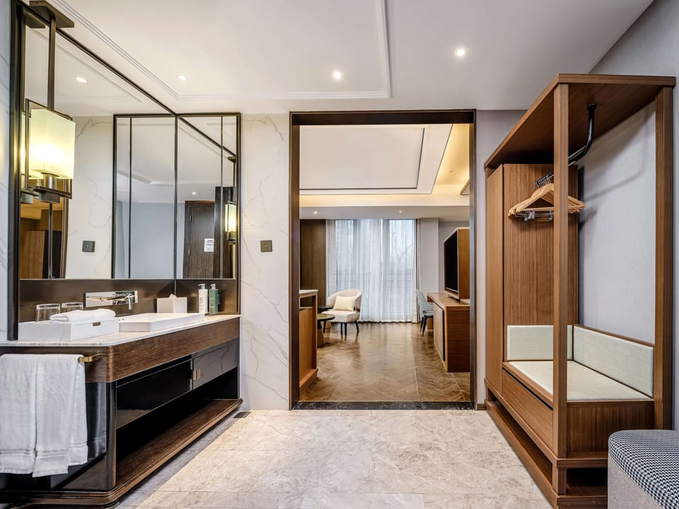 Premium Room, 1 King Bed | Bathroom | Hair dryer, slippers, towels, shampoo