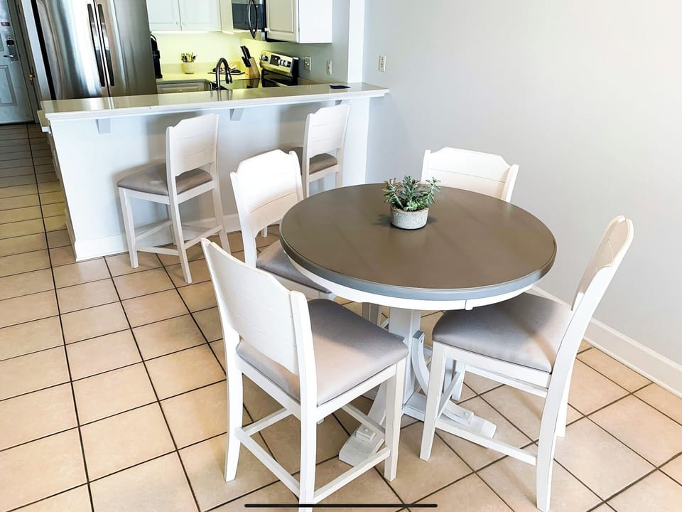 Dining table and four chairs and two chairs on the brand new quartz island. 