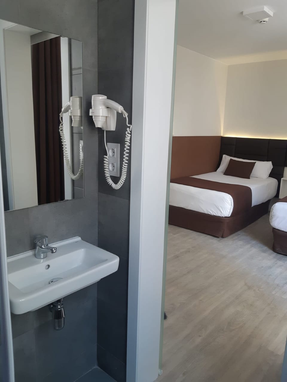 Twin Room | Bathroom | Shower, hair dryer, towels, soap