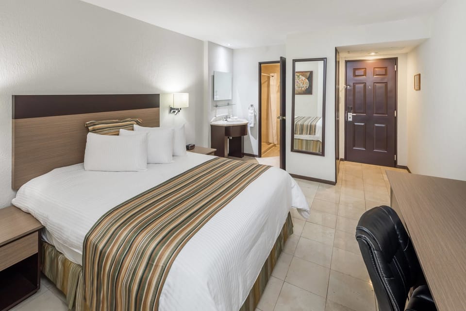Down comforters, pillowtop beds, in-room safe, desk