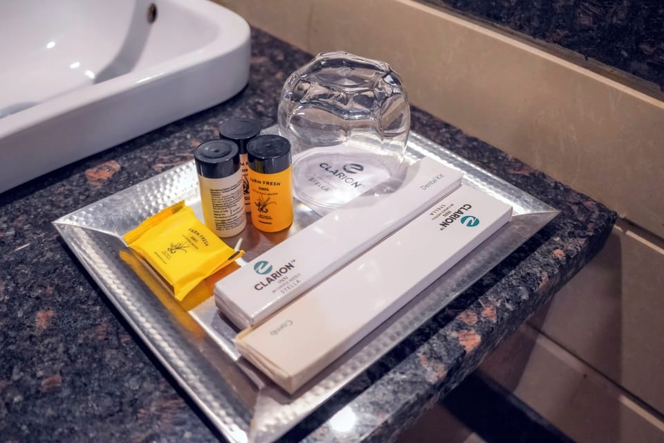 Combined shower/tub, designer toiletries, hair dryer, bathrobes