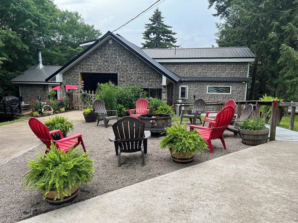 Authentic Adirondack at its best - stone lodge, spacious fire circle seating.