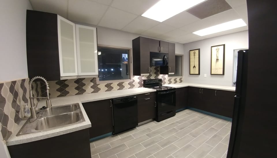 New kitchen with dishwasher, microwave, stove and refrigerator.