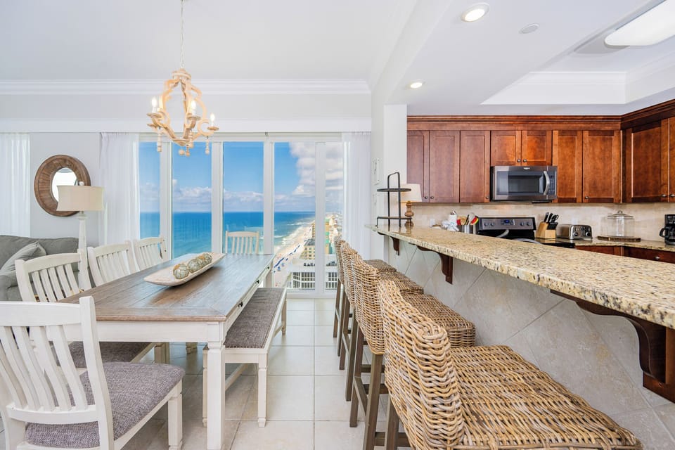 Dine at the spacious table or the bar while enjoying expansive views of the coastline and bright natural light