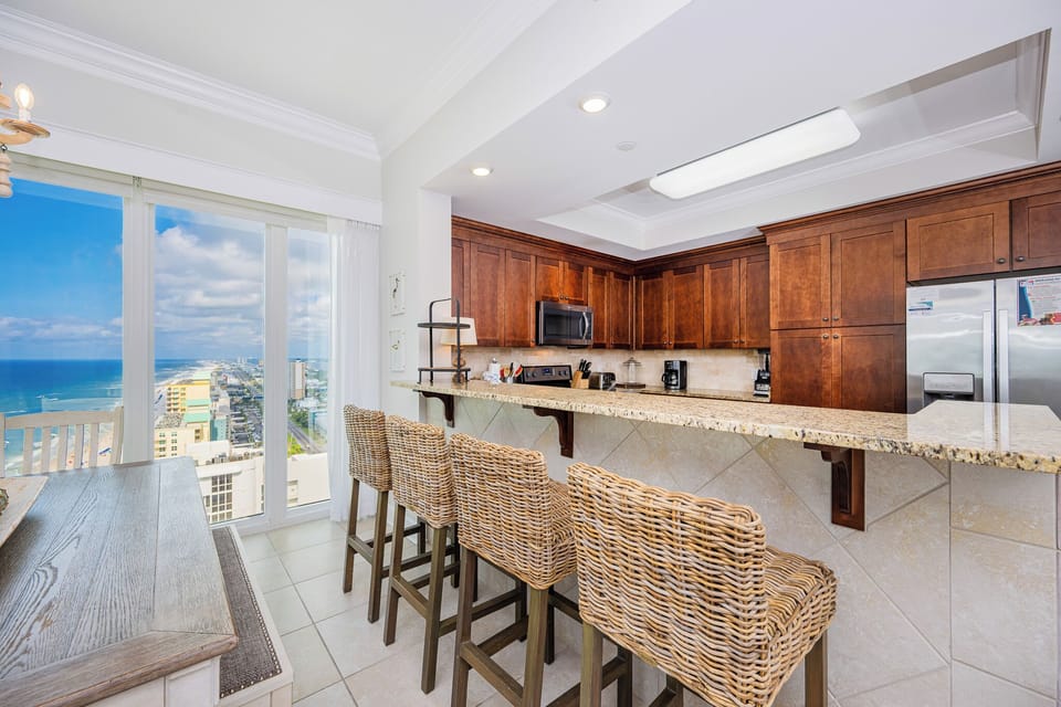 Gather around the inviting breakfast bar, where you can enjoy morning coffee with views of the coastline