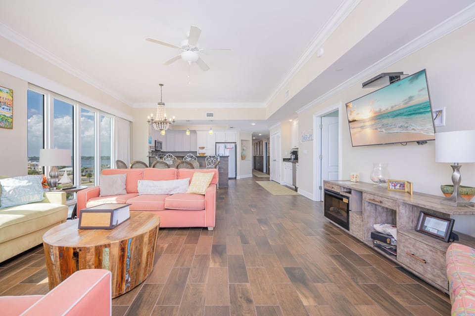 Unwind on the colorful sofa with queen sleeper while enjoying the inviting atmosphere and beachfront views