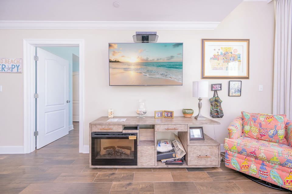 Enjoy the inviting decor and a large TV in the living space with beachfront views