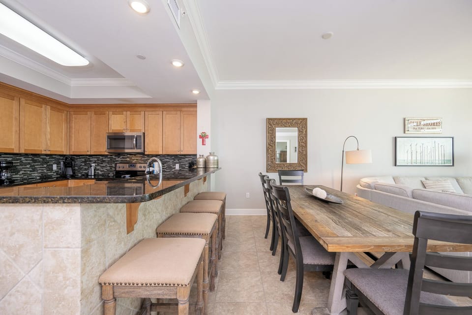 Enjoy a casual meal at the bar, surrounded by inviting decor and warm tones