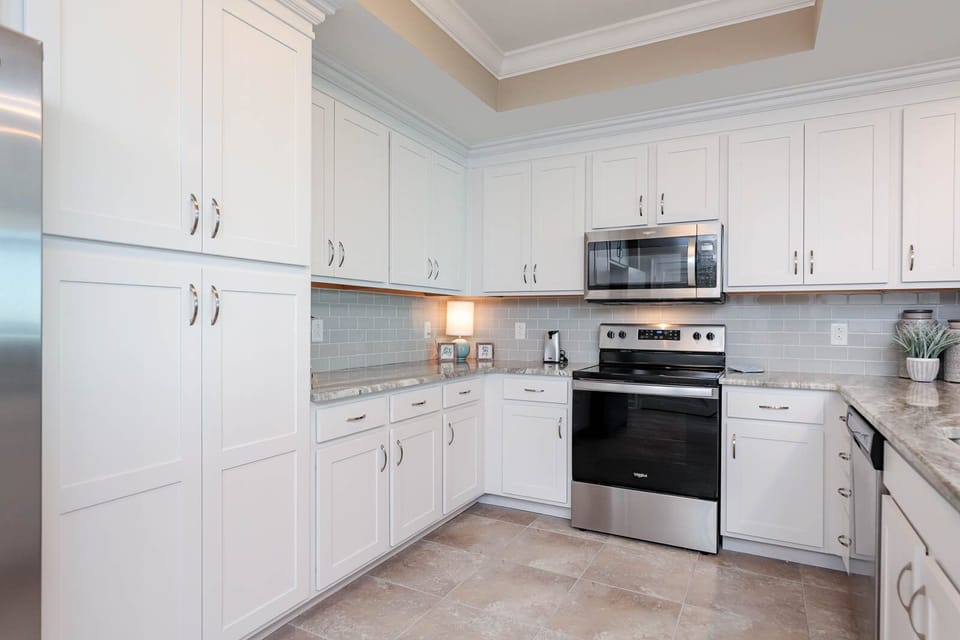 Embrace your culinary creativity in the kitchen, perfect for cooking delicious dishes from your beachside retreat