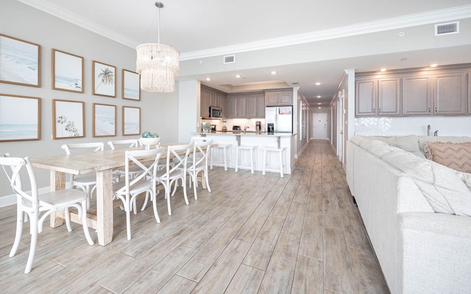Gather in this welcoming living space and enjoy stunning beach views from the balcony