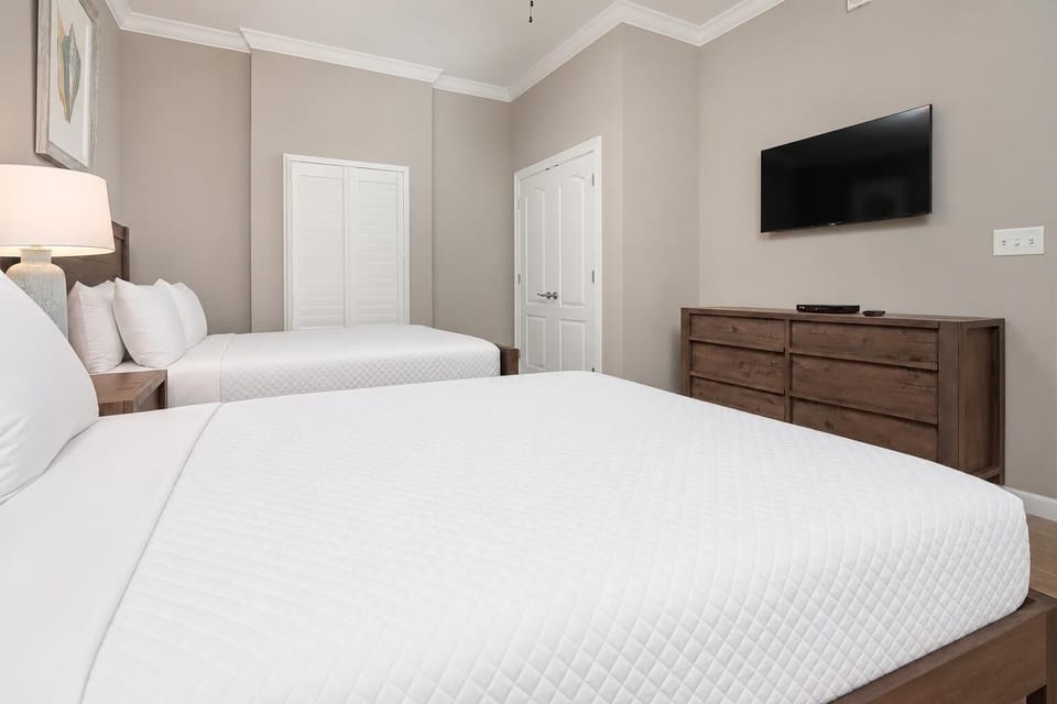 Find tranquility in this guest bedroom, where soft queen beds invite you to relax and recharge after beach adventures