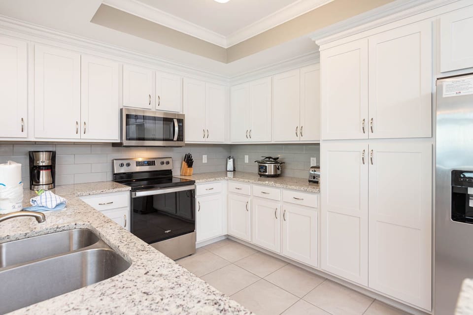 Create culinary delights in the kitchen, furnished with stainless appliances and ample counter space for creativity