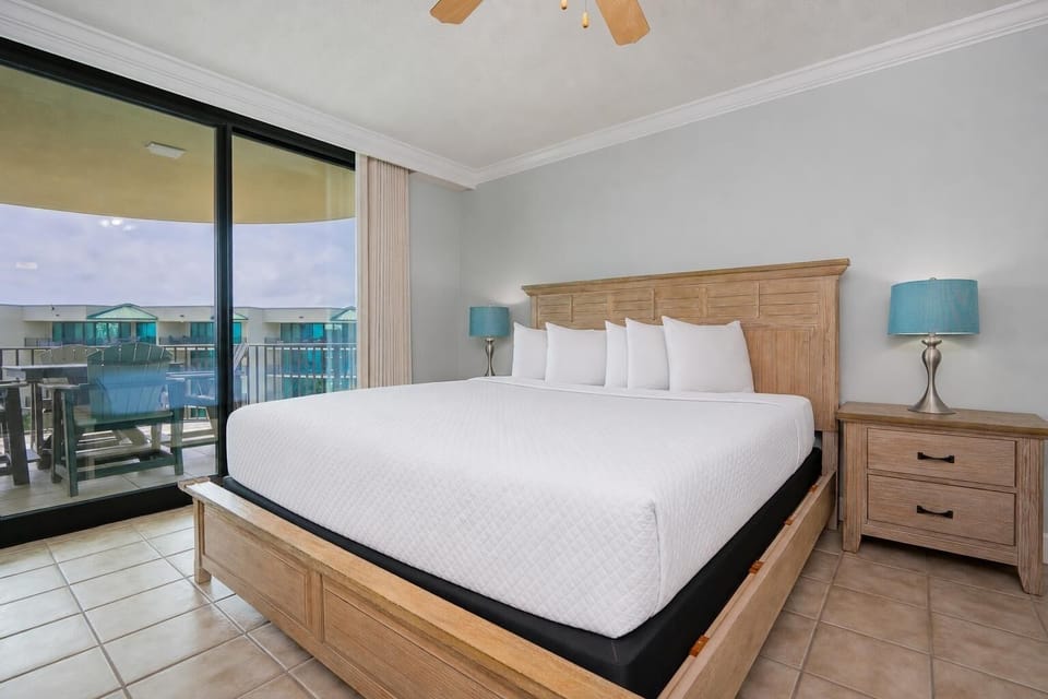 King bed in the master suite invites restful nights after enjoying your balcony's gentle sounds