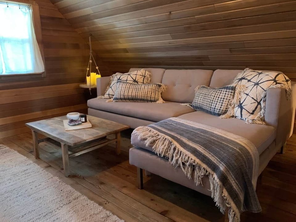 Cuddle up and read a book on the comfy sofa