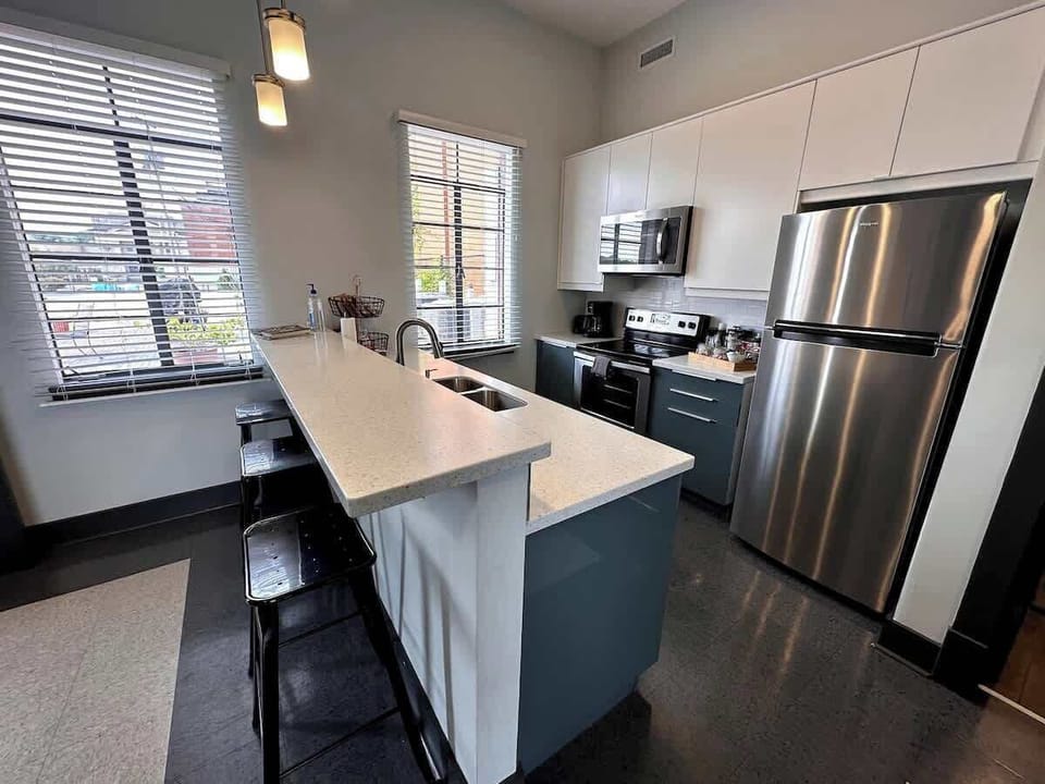 Kitchen with modern appliances and bright lighting