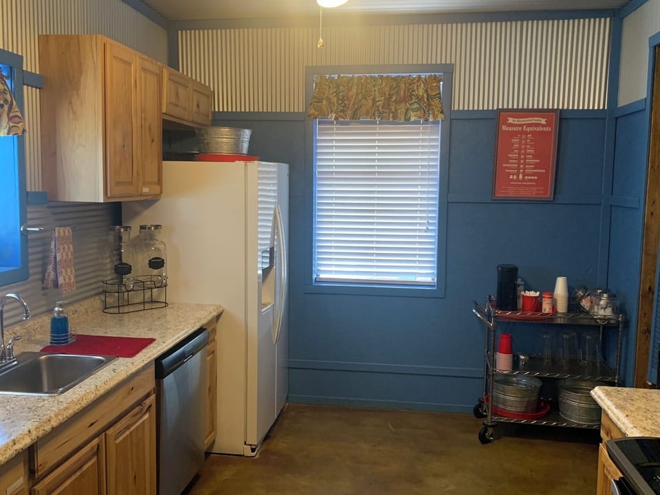 full kitchen with fridge, stovetop, oven, microwave, dishwasher and more
