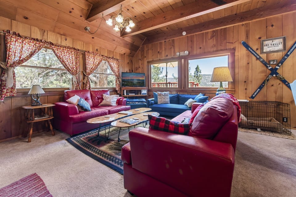 Living room with views out every window (new couch photos coming soon, its even cozier now)
