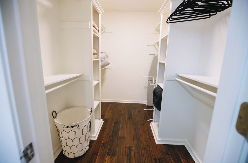 Closets with extra bedding/ pillows/comforter/ iron/ iron board/ drying rack