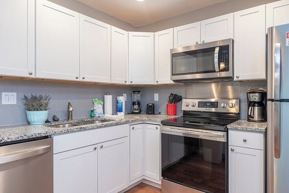 Updated kitchen with stainless steel appliances.