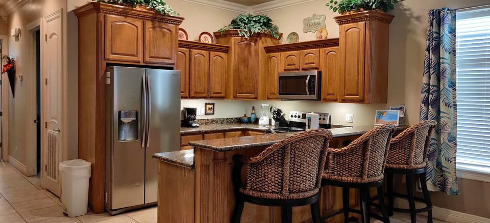 Kitchen with granite countertops. 