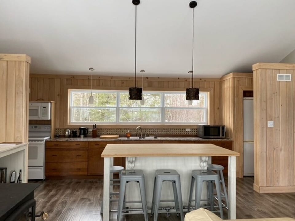 Large kitchen and counter for cooking.