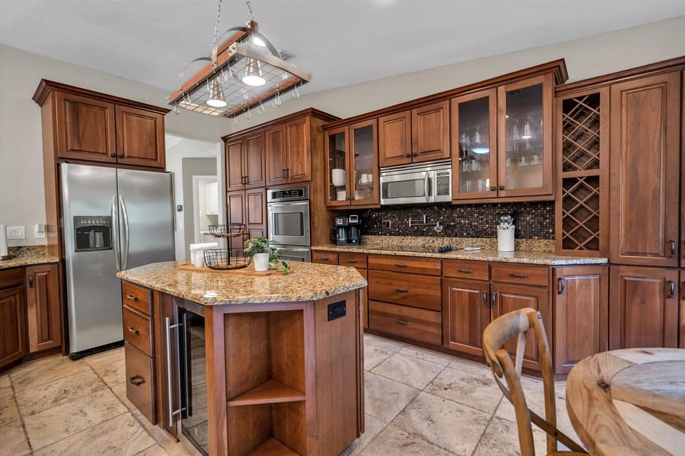 Hello-Check out this Kitchen! Everything you could ever want: Double Oven, Wine Fridge, Water/ Ice Fridge, Dishwasher and a Pot Filler!