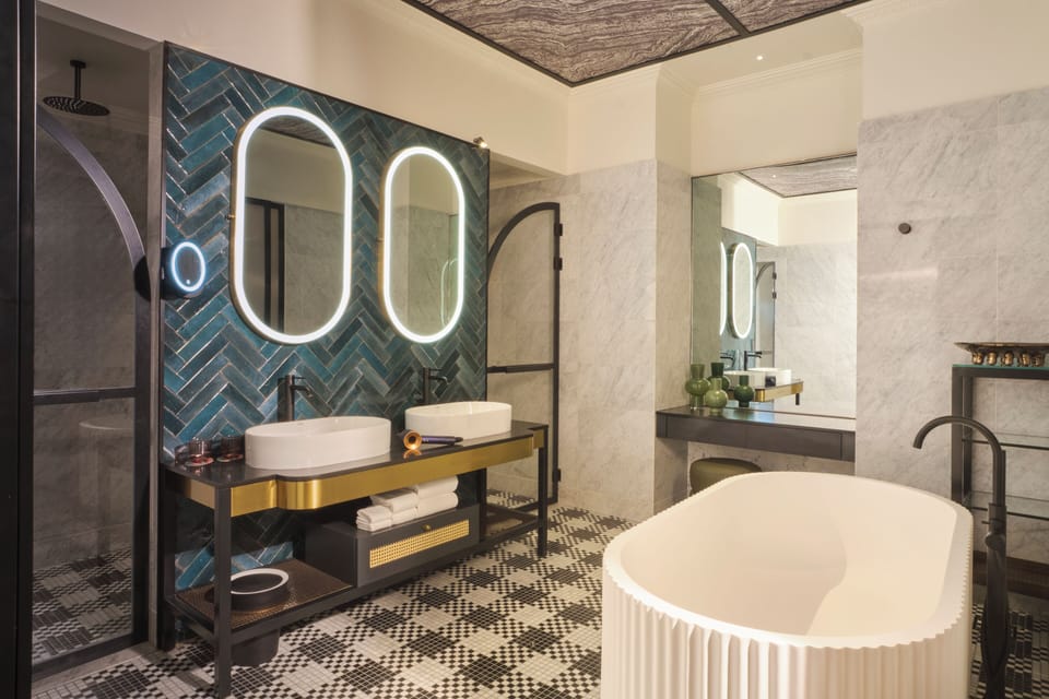 Balcony Suite | Bathroom | Designer toiletries, hair dryer, bathrobes, slippers
