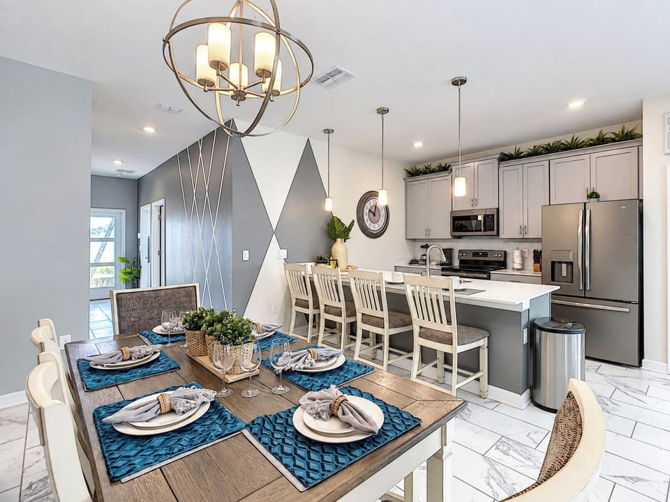 Modern Kitchen with Breakfast Bar and Elegant Dining Table