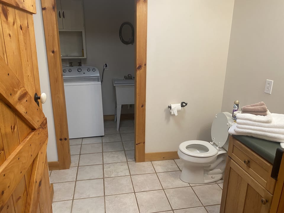 Downstairs full bathroom and laundry room 