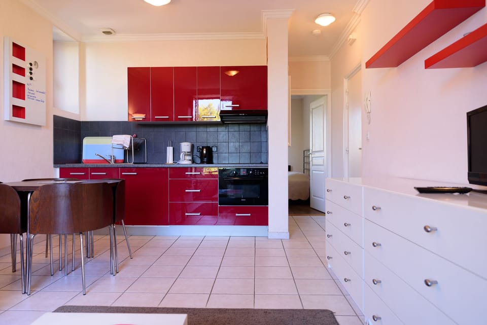 Apartment, 1 Bedroom | Living area | 80-cm flat-screen TV with digital channels, TV