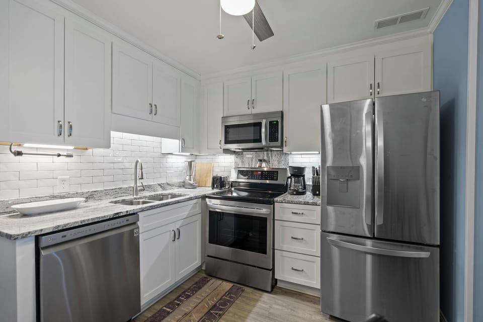 Your fully equipped kitchen features granite countertops, stainless steel appliances, and everything you need to prepare memorable meals during your stay.