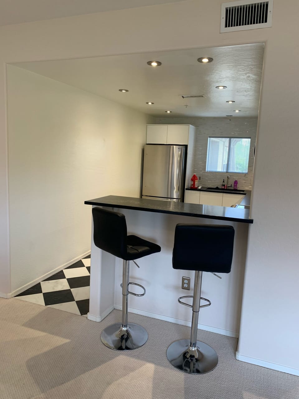 Bar counter in kitchen - stools with height adjustments