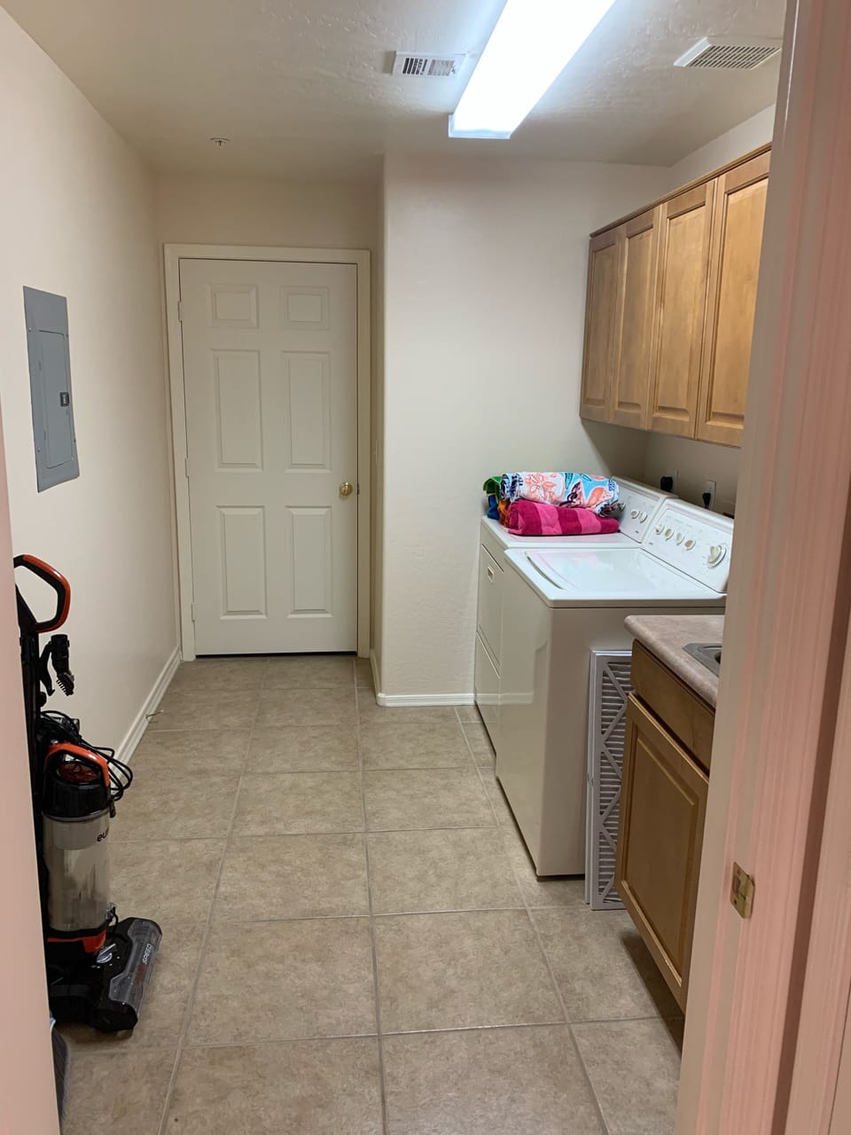 Spacious laundry with added storage room in back