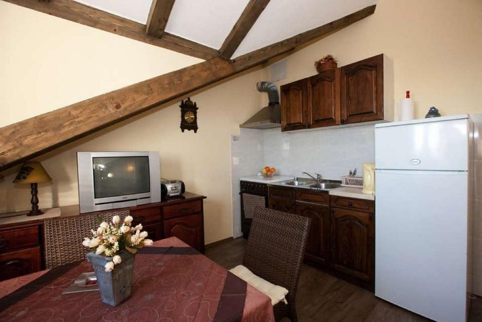 Apartment (One Bedroom Apartment with Sea View) | Private kitchen | Fridge, coffee/tea maker, toaster, dining tables