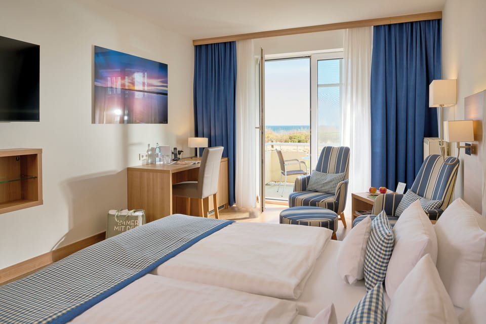 Standard Double Room, Balcony, Ground Floor | Minibar, in-room safe, individually decorated, desk