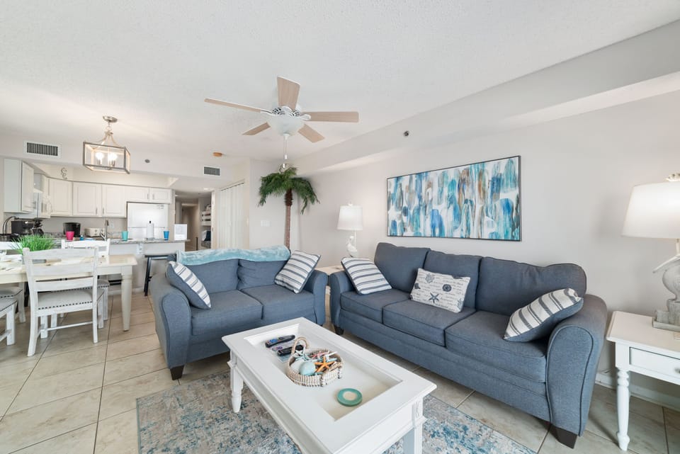 Maximize your comfort and sleeping arrangements with our versatile living area, showcasing a convenient sleeper sofa. Enjoy stunning panoramic ocean vistas right from your accommodation.