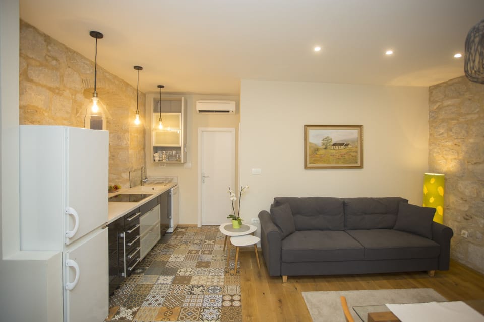 One Bedroom Apartment with Balcony | Living area | 125-cm LCD TV with cable channels, TV