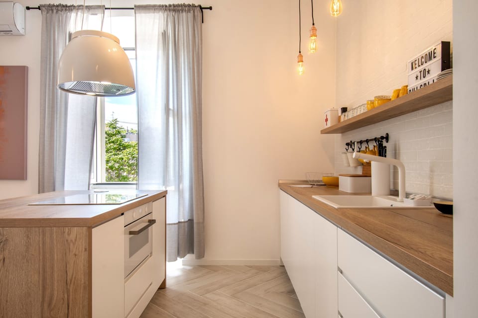 Comfort Apartment | Private kitchen | Fridge, coffee/tea maker, electric kettle, highchair